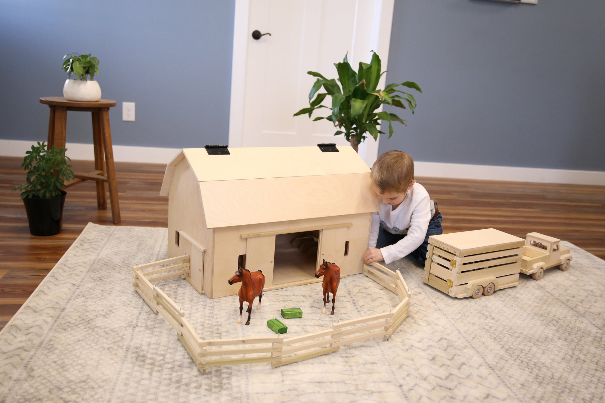 Amish-made large unfinished wooden hip-roof barn toy from AmishToyBox.com, designed for kids' farming play and imaginative fun.