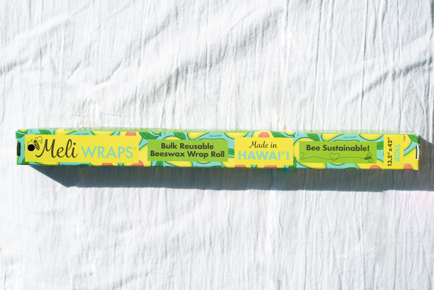 Beeswax Wrap Bulk Roll from Meli Wraps with avocado print, reusable beeswax food wrap for eco-friendly storage.