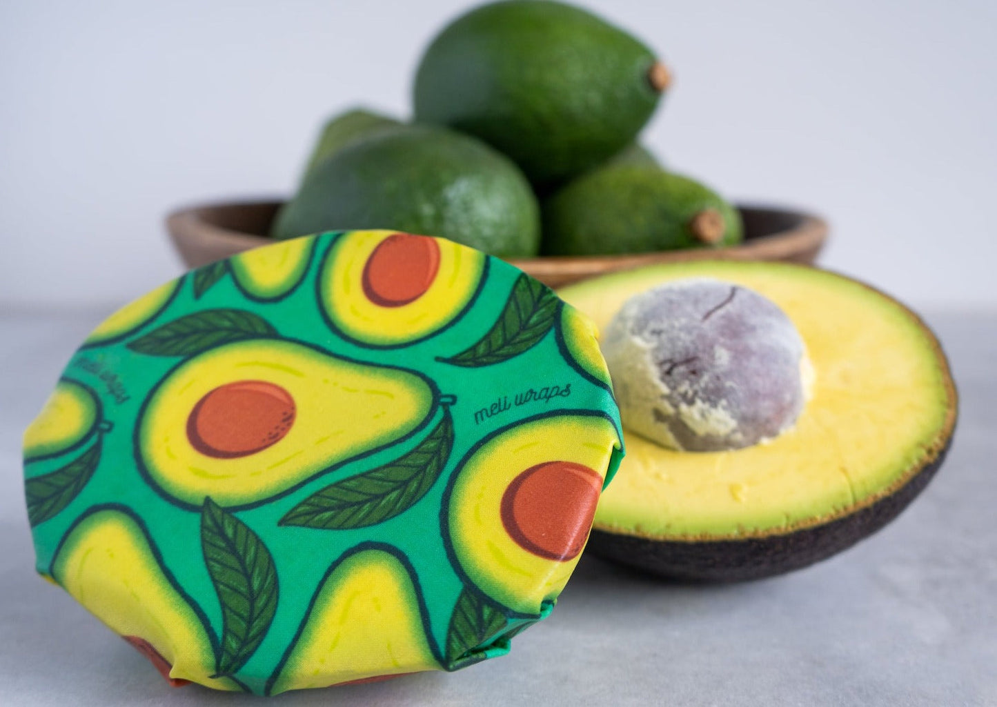 Set of three Meli Wraps beeswax food wraps in avocado print, medium and large sizes for eco-friendly food storage.