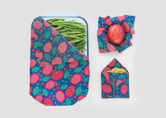 Set of Meli Wraps beeswax food wraps with vibrant dragonfruit print in small, medium, and large sizes, perfect for food storage.
