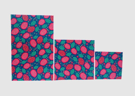 Set of Meli Wraps beeswax food wraps in small, medium, and large with vibrant dragonfruit print for food storage and freshness.