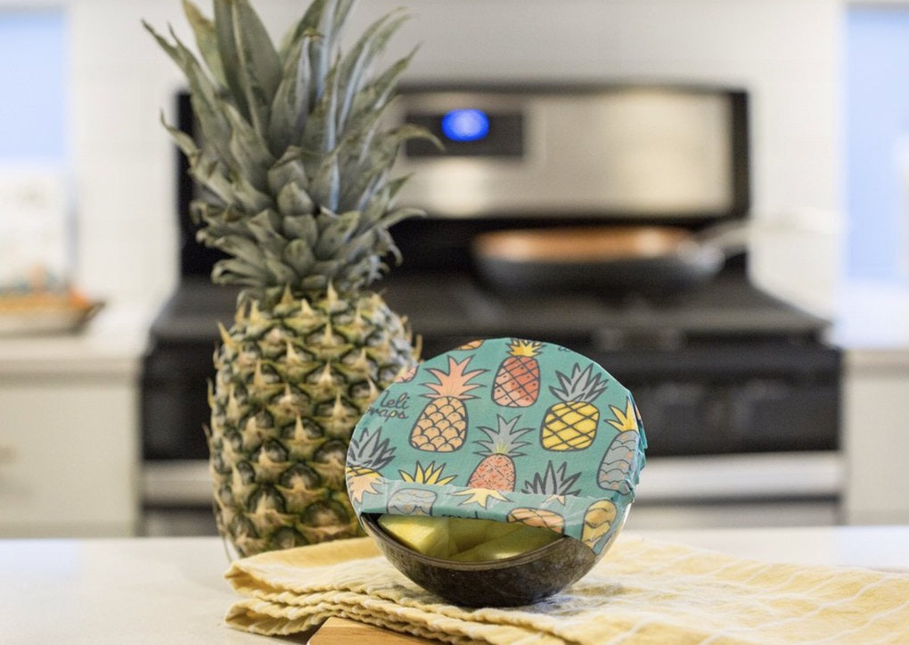 Set of three Meli Wraps beeswax food wraps with pineapple print in small, medium, and large sizes for food storage.