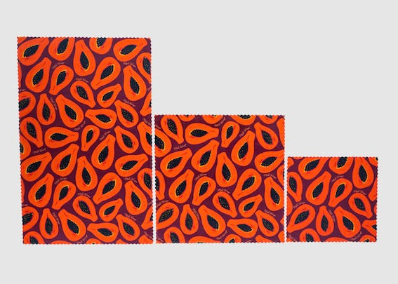 Set of Meli Wraps beeswax food wraps in purple papaya print, featuring small, medium, and large sizes for food covering and storage.