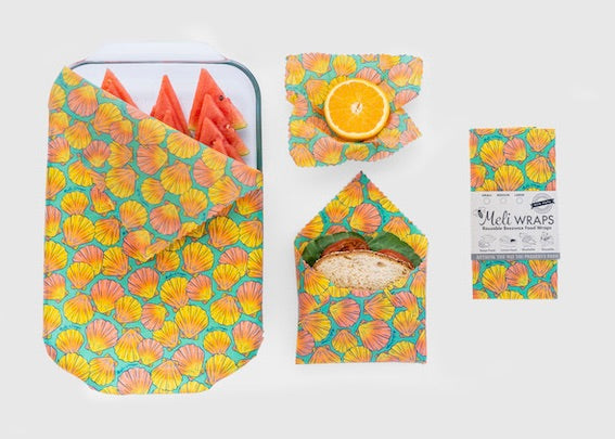 Set of Meli Wraps beeswax food wraps in sunrise shell print, including small, medium, and large sizes for food storage.