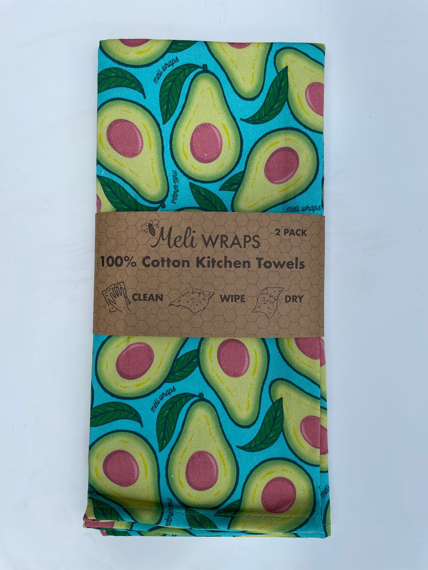 Set of two avocado-themed kitchen towels made of 100% cotton by Meli Wraps, featuring a vibrant green avocado design.