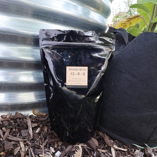2lb bag of MIgardener Blood Meal, a natural fertilizer supplement for organic gardening and plant growth.