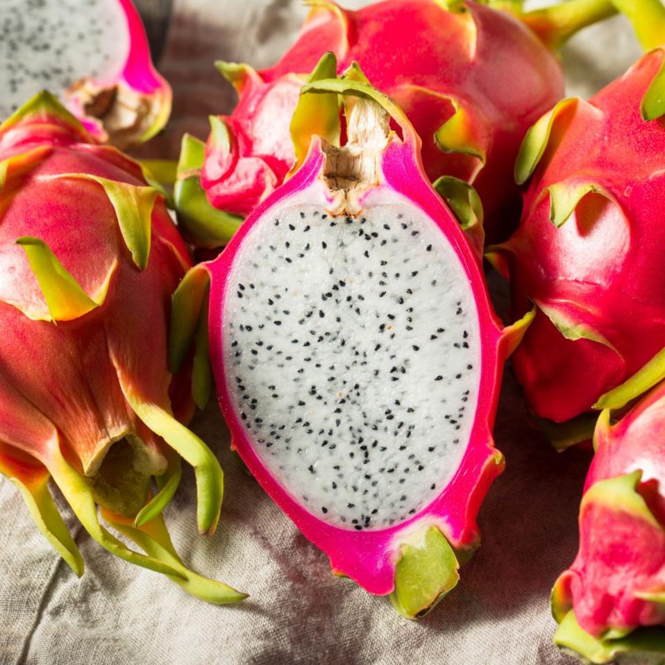 Exotic white dragonfruit from MIgardener, with vibrant white flesh and pink skin, displayed in a close-up shot.