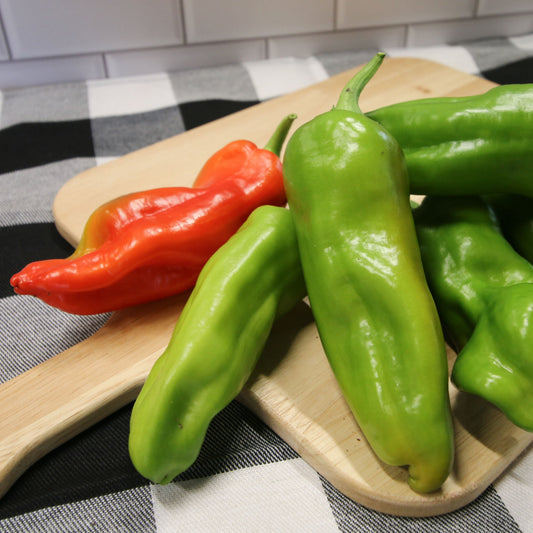 Fresh green Cubanelle pepper from MIgardener, elongated shape with smooth skin, ideal for cooking and flavoring dishes.