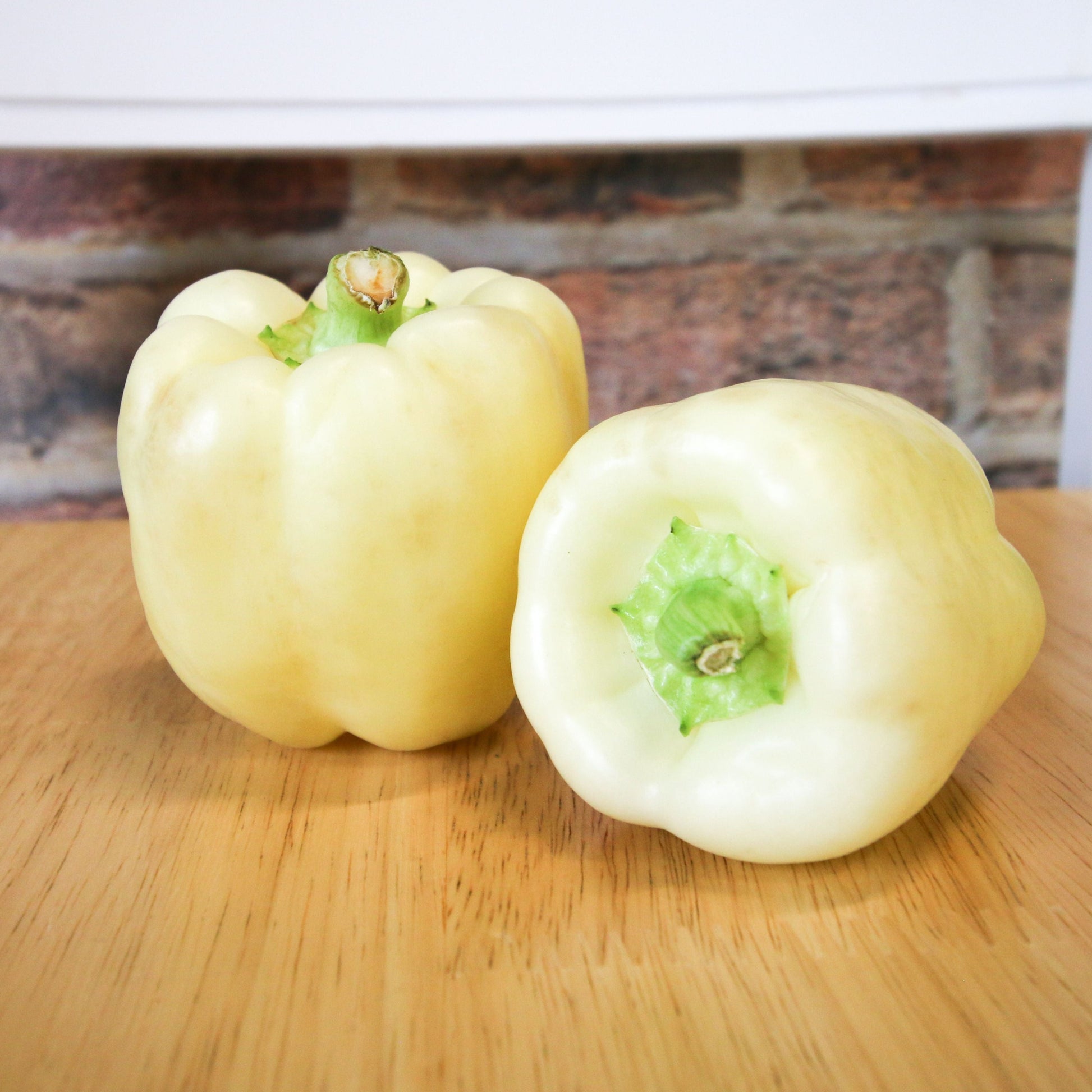Fresh diamond-shaped bell pepper from MIgardener, showcasing its vibrant green color and glossy surface.