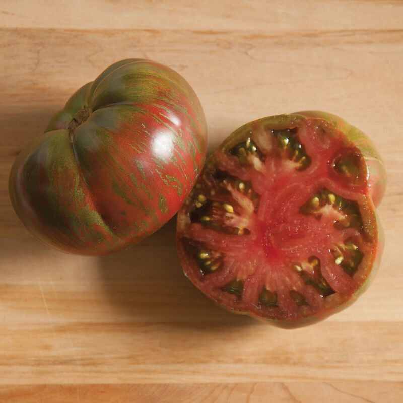 Pink Berkley Tie Dye Tomato from MIgardener, showcasing vibrant pink and tie-dye patterns on a ripe, fresh tomato.