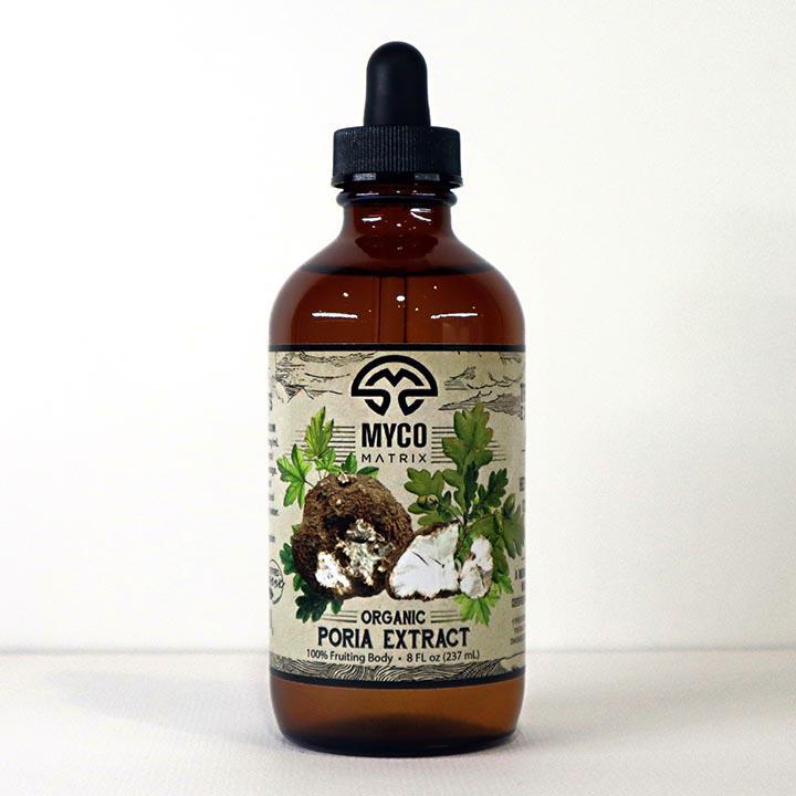 Mycomatrix Poria adaptogenic mushroom extract by Mushroom Mountain in a 2oz jar, showing the product label and packaging.
