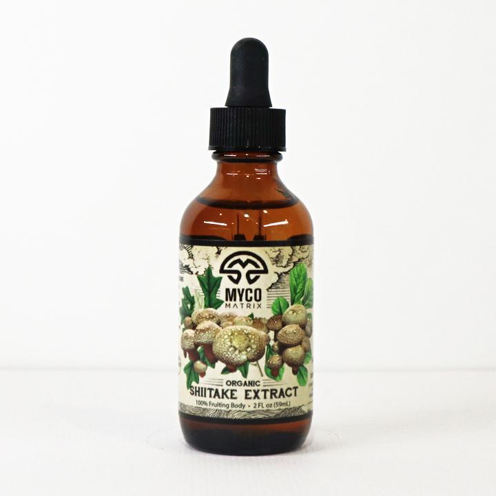 Mycomatrix Shiitake adaptogenic mushroom extract in a 2oz bottle by Mushroom Mountain, featuring fresh shiitake mushrooms.