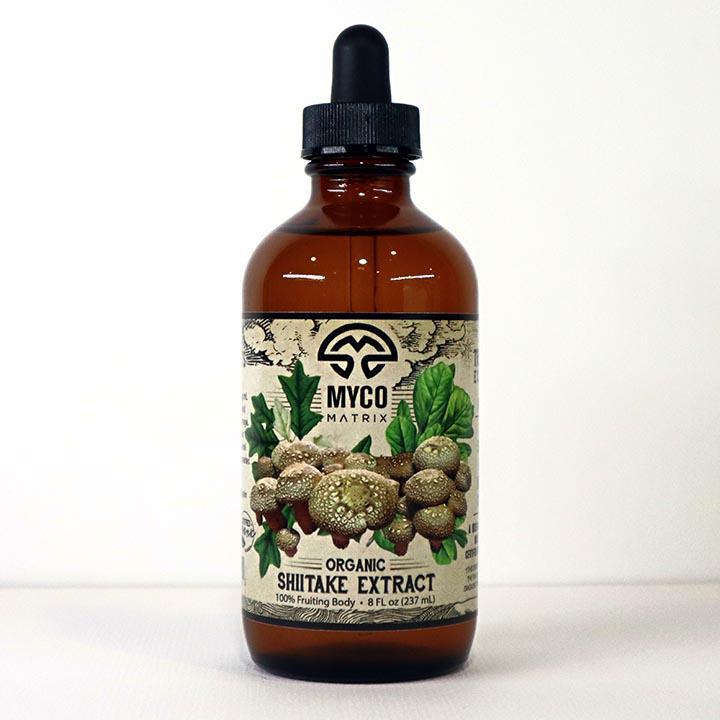 Mycomatrix Shiitake adaptogenic mushroom extract in a 2oz bottle from Mushroom Mountain, featuring a label with mushrooms and natural ingredients.