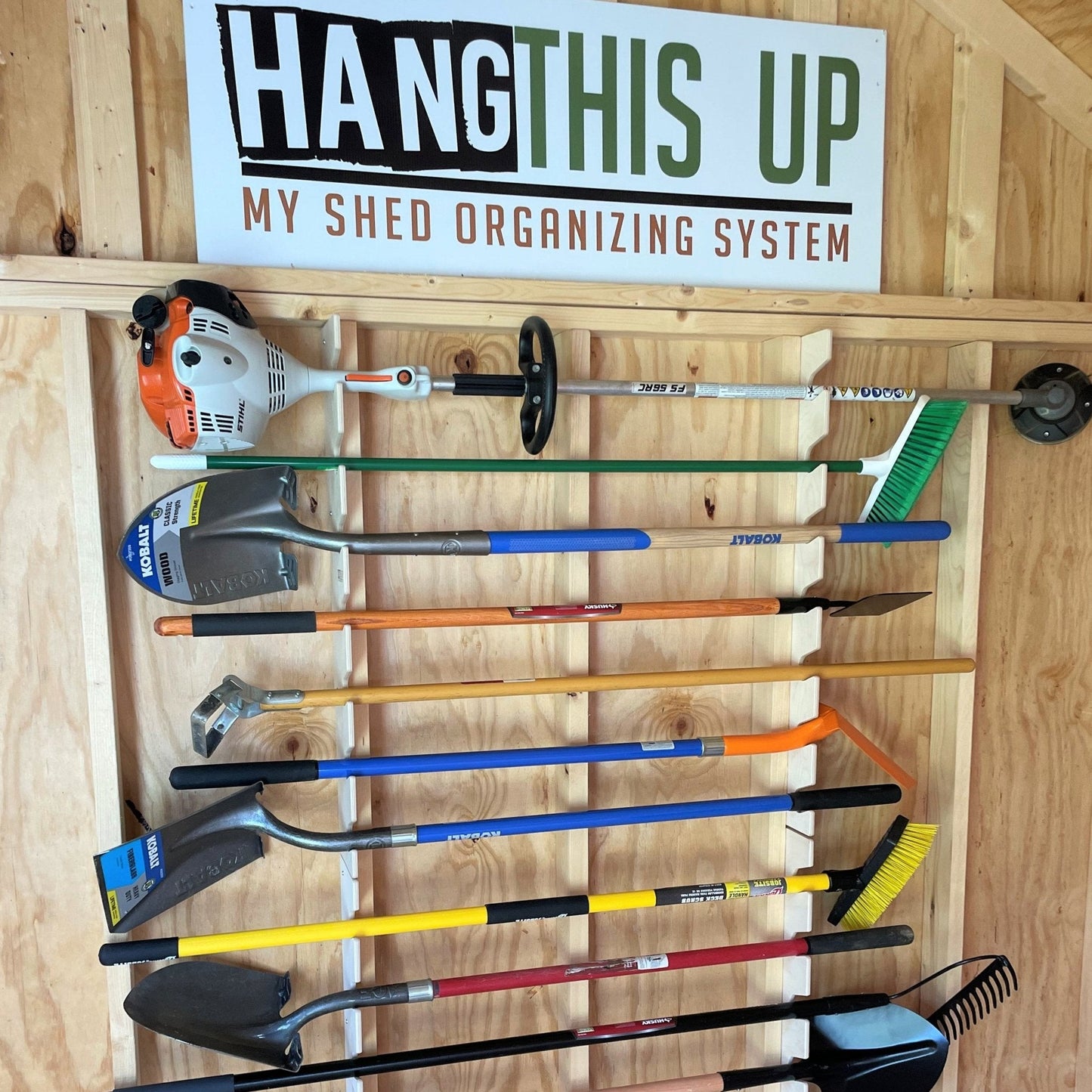 HangThis Up shed organization kit with garden tool rack, hooks, and shelving for outdoor yard and garden tool storage.