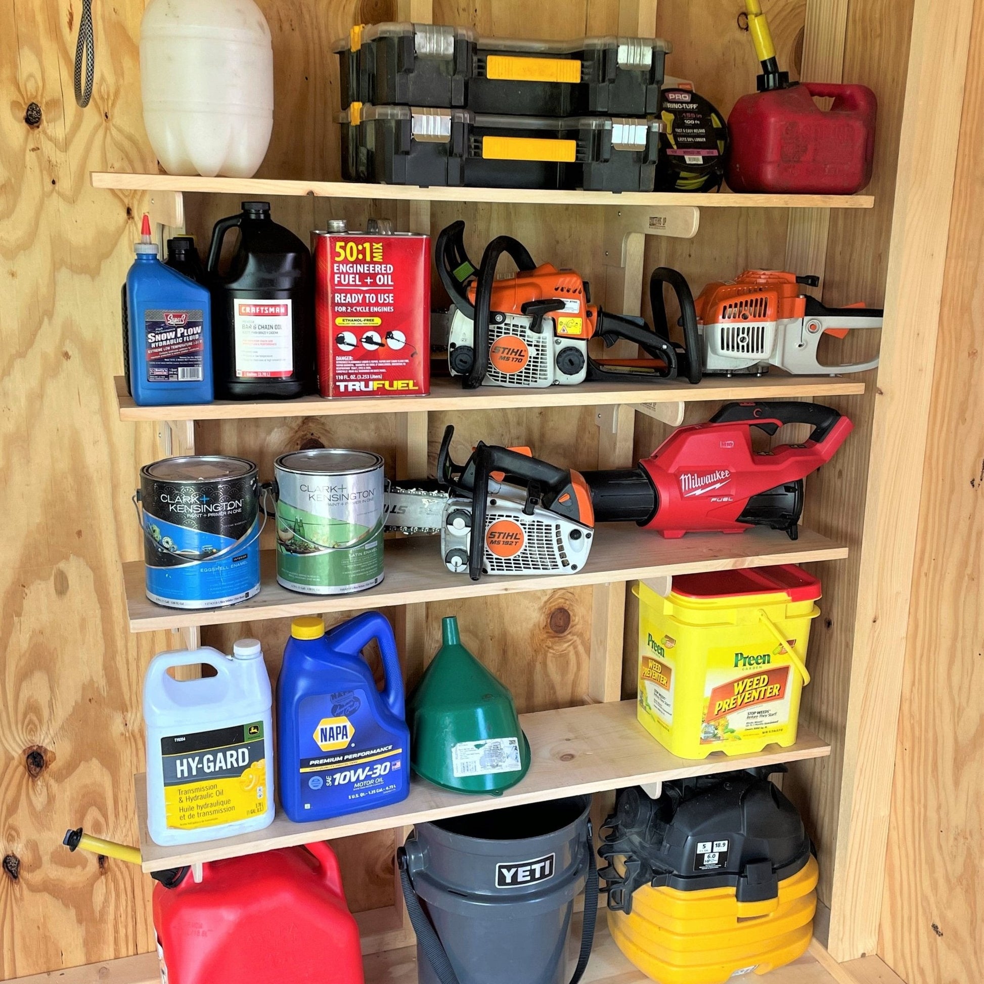 Complete shed organization kit by HangThis Up with garden tool rack, hooks, and shelving for outdoor shed storage.