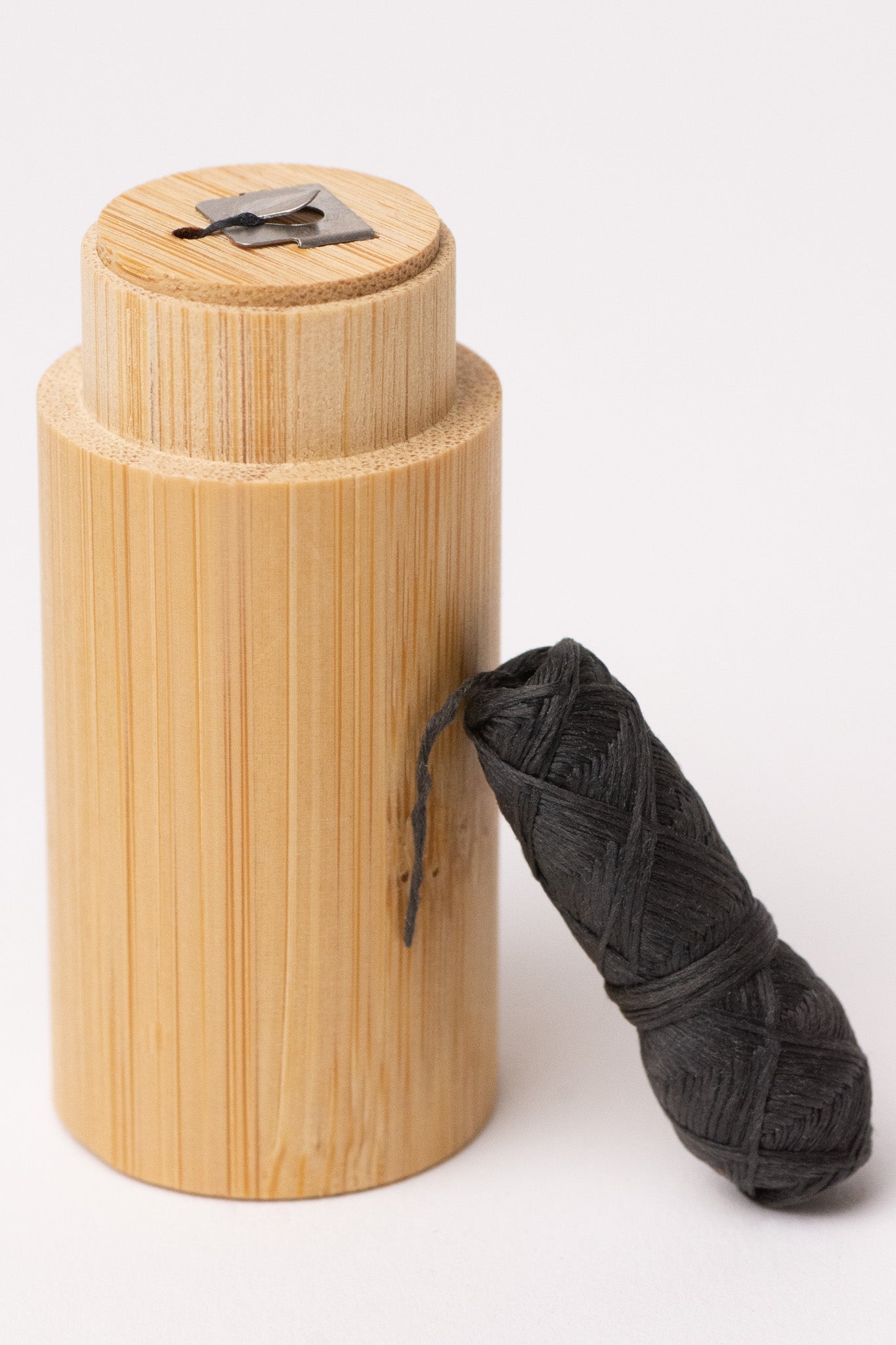 Charcoal floss with bamboo holder from NO TOX LIFE, eco-friendly dental floss in a natural bamboo container.
