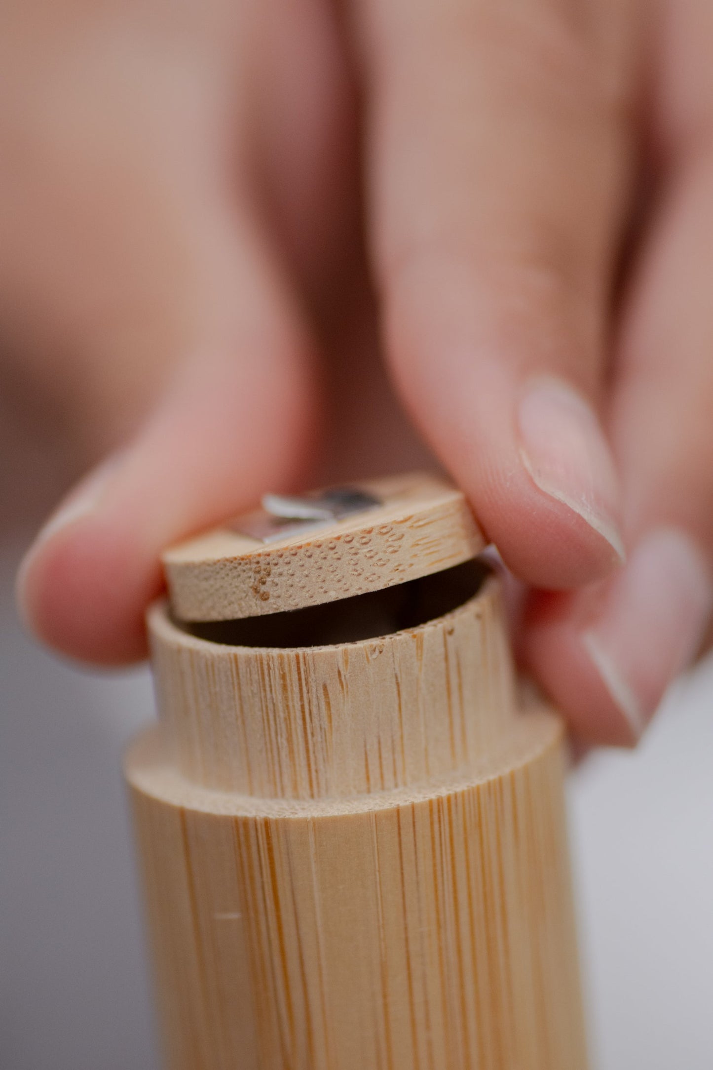 Charcoal floss with bamboo holder from NO TOX LIFE, eco-friendly dental floss in a sleek bamboo container.