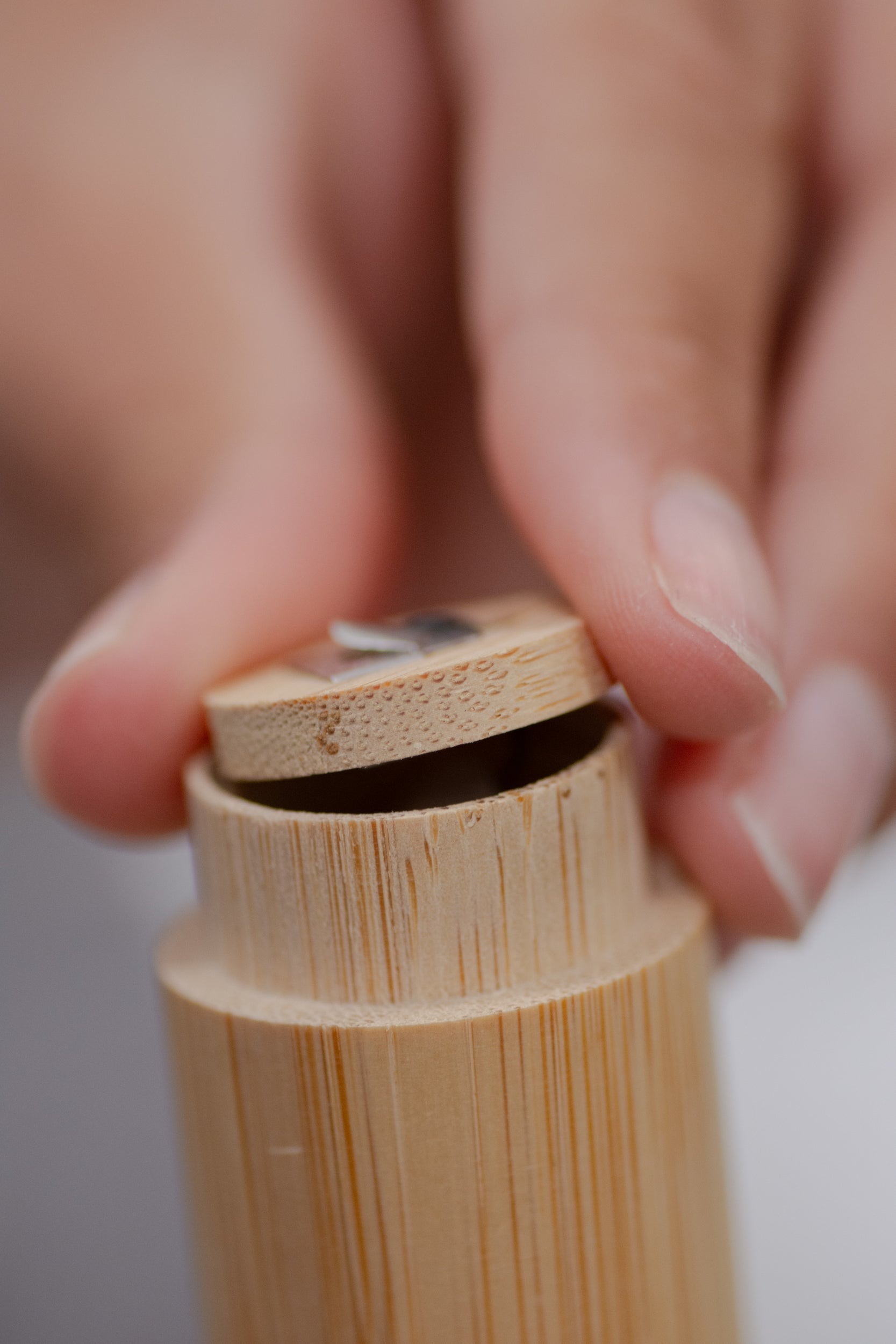 Charcoal floss with bamboo holder from NO TOX LIFE, eco-friendly dental floss in a sleek bamboo container.
