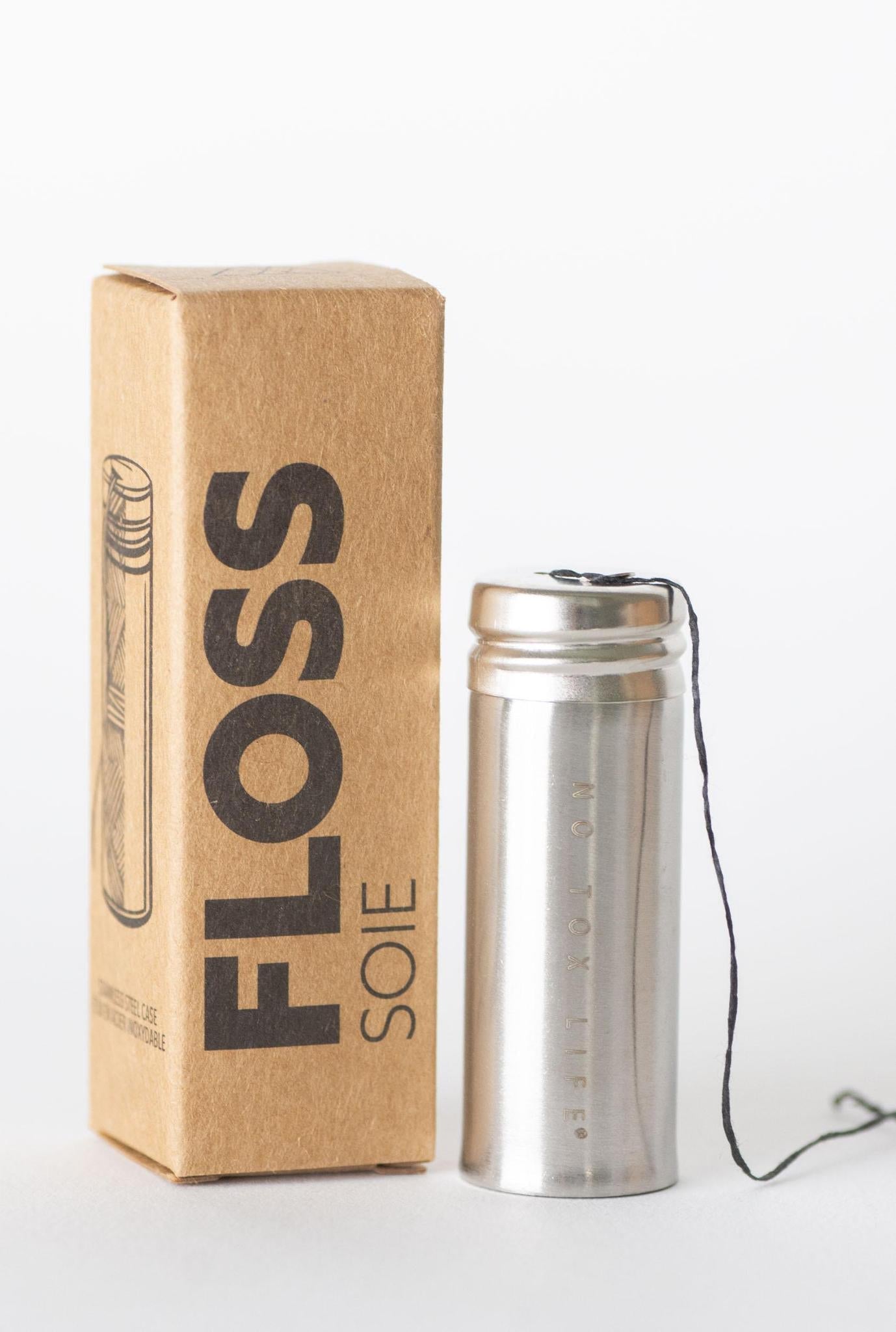 Charcoal floss in stainless steel holder by NO TOX LIFE, eco-friendly dental floss for oral hygiene.