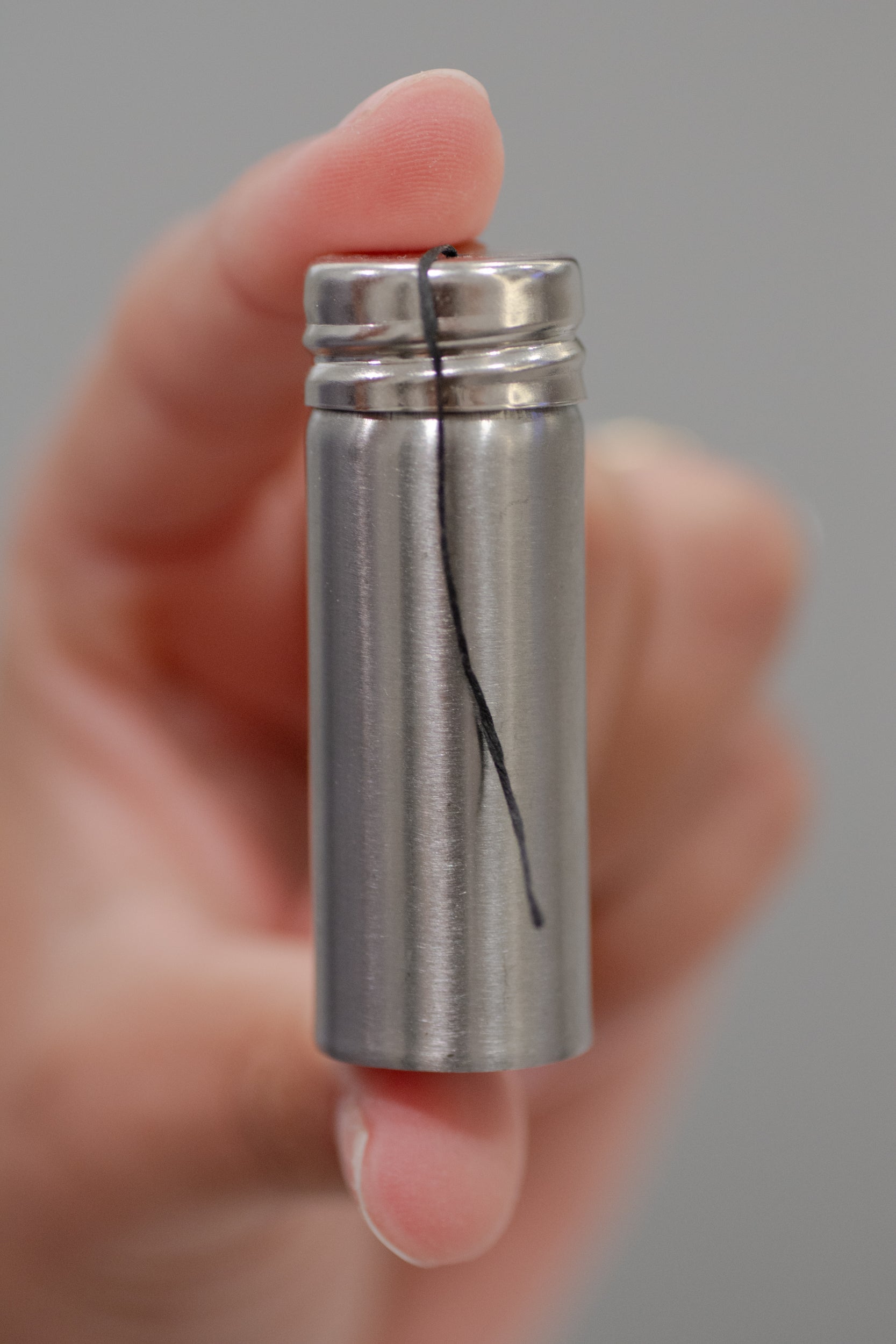 Charcoal floss in stainless steel holder from NO TOX LIFE, eco-friendly dental floss accessory with sleek design