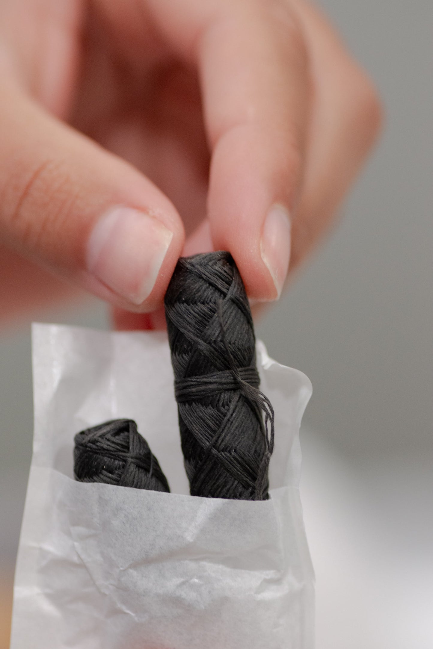 Stainless steel holder for Charcoal Floss by NO TOX LIFE, showcasing the eco-friendly dental floss container with black charcoal floss.