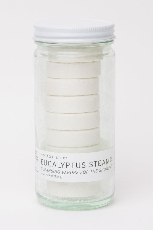 Eucalyptus Steam cleansing vapors for shower in a normal jar by No Tox Life, featuring fresh eucalyptus leaves and vapor release.