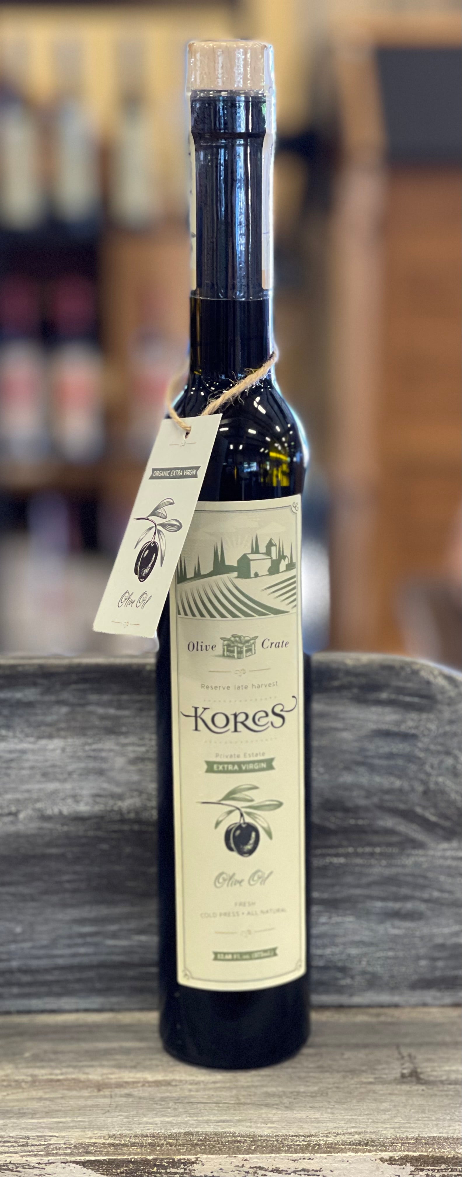 Bottle of Olive Crate extra virgin olive oil from Kores Estate, 375ml, with a dark glass container and label visible.