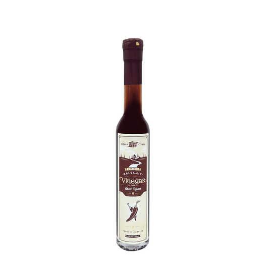 Organic balsamic vinegar with chili pepper from Olive Crate, featuring a dark, flavorful liquid in a glass bottle with chili flakes visible.
