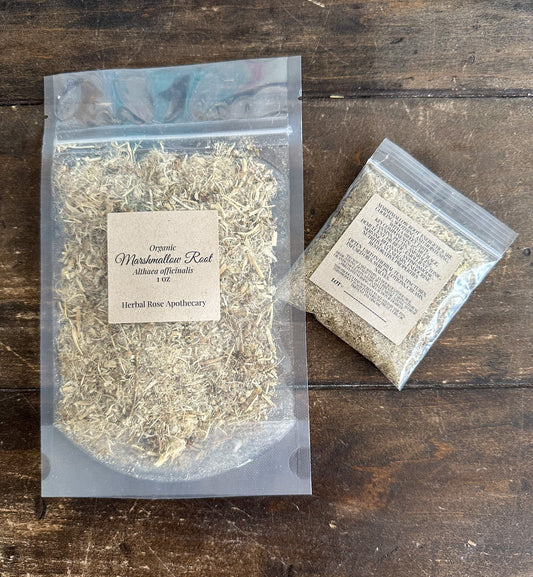 Organic marshmallow root from herbalroseapothecary, showing dried herbal roots with natural earthy tones and textured surface.