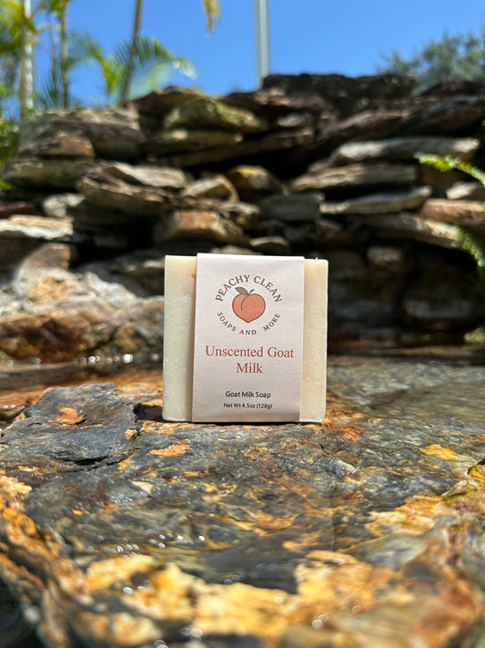 Unscented goat milk soap by Peachy Clean Soaps and More LLC, creamy white bar with smooth surface, natural skincare product.