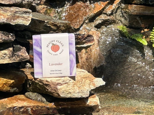 Lavender soap by Peachy Clean Soaps and More LLC with a creamy lather and fresh lavender scent in a clear soap dish