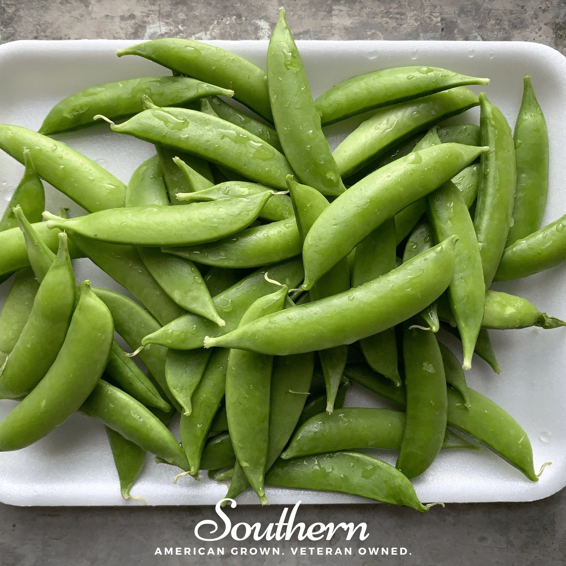 Sugar snap peas seeds from Southern Seeds, showing green pea pods and seeds ready for planting.