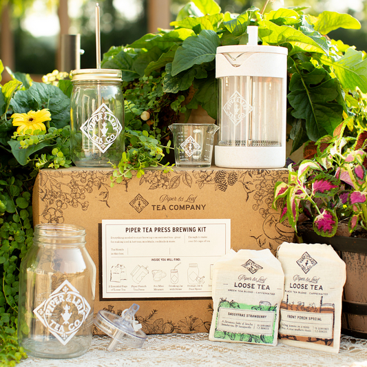 Piper and Leaf Tea Co. Piper Press Brew Kit for tea gifts, featuring a classic design with strawberry flavor accents and brewing accessories.