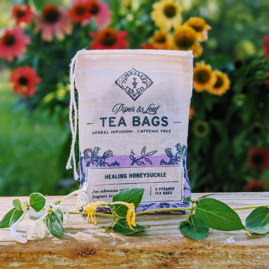 Healing Honeysuckle 9ct tea bags from Piper and Leaf Tea Co. in muslin sachets, showcasing the herbal tea packaging and tea bags.