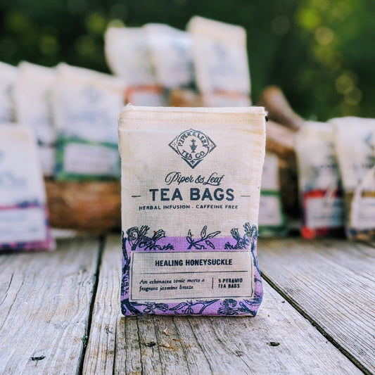 Healing Honeysuckle 9ct tea bags by Piper and Leaf Tea Co. in muslin, showcasing the tea bags with floral packaging.