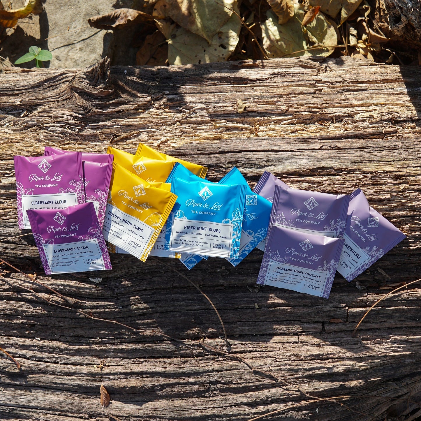 Assorted wellness tea sampler box with 16 tea bags from Piper and Leaf Tea Co., featuring herbal, green, and relaxing tea varieties.