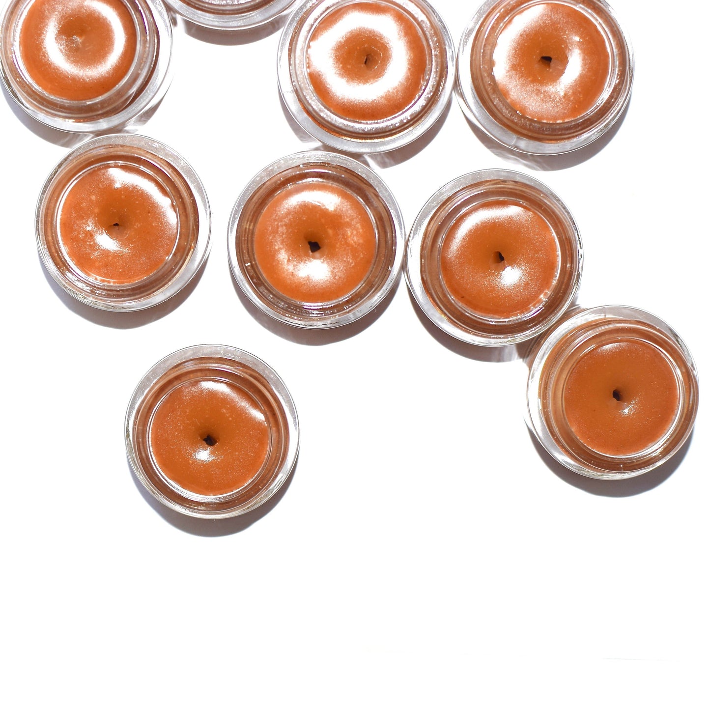 Plant Makeup Cinnamon Lip Plumper showing a tube of lip gloss with cinnamon flavor and natural packaging.