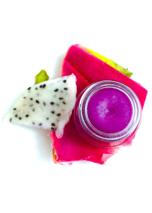 Plant Makeup Dragon Fruit Lip Gloss in clear tube with pink tint, featuring a vibrant dragon fruit flavor label.