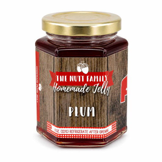 Sweet plum jelly in a jar, 9 oz, from Nutt Family Jams & Jellies, perfect for spreading or topping desserts.