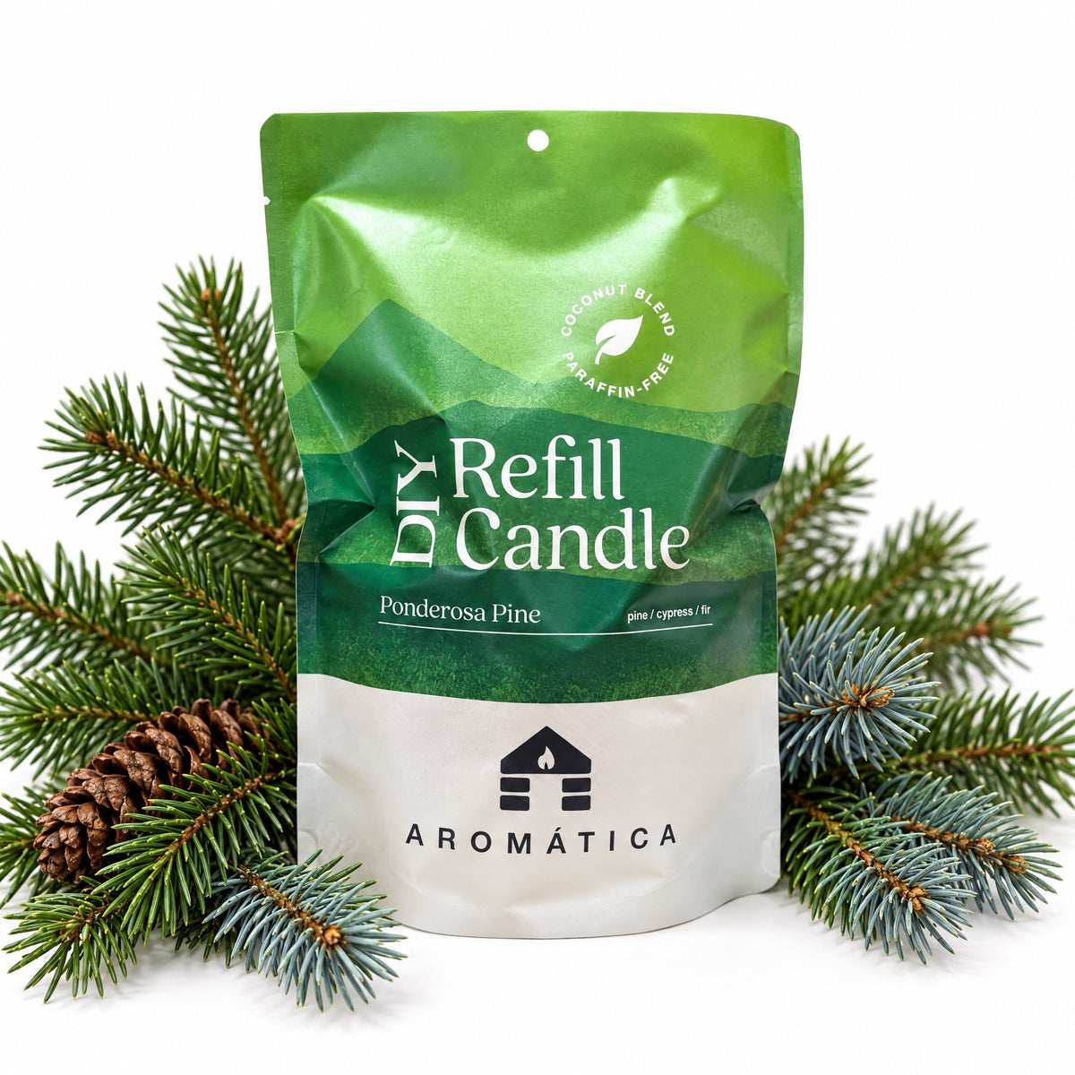 Bluecorn Candles Aromática scented candle refill kit with ponderosa pine scent, including pine sprigs for a natural aroma.