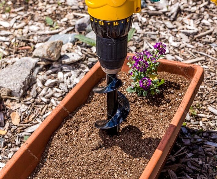 Power Planter Augers gardening auger for flower planting and grass plugs, 2-inch by 7-inch size, ideal for efficient soil work.
