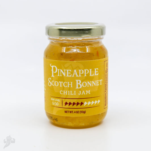 Pineapple Scotch Bonnet Chili Jam from Powerful Pepper Company, showcasing vibrant pineapple and chili spread in a jar.