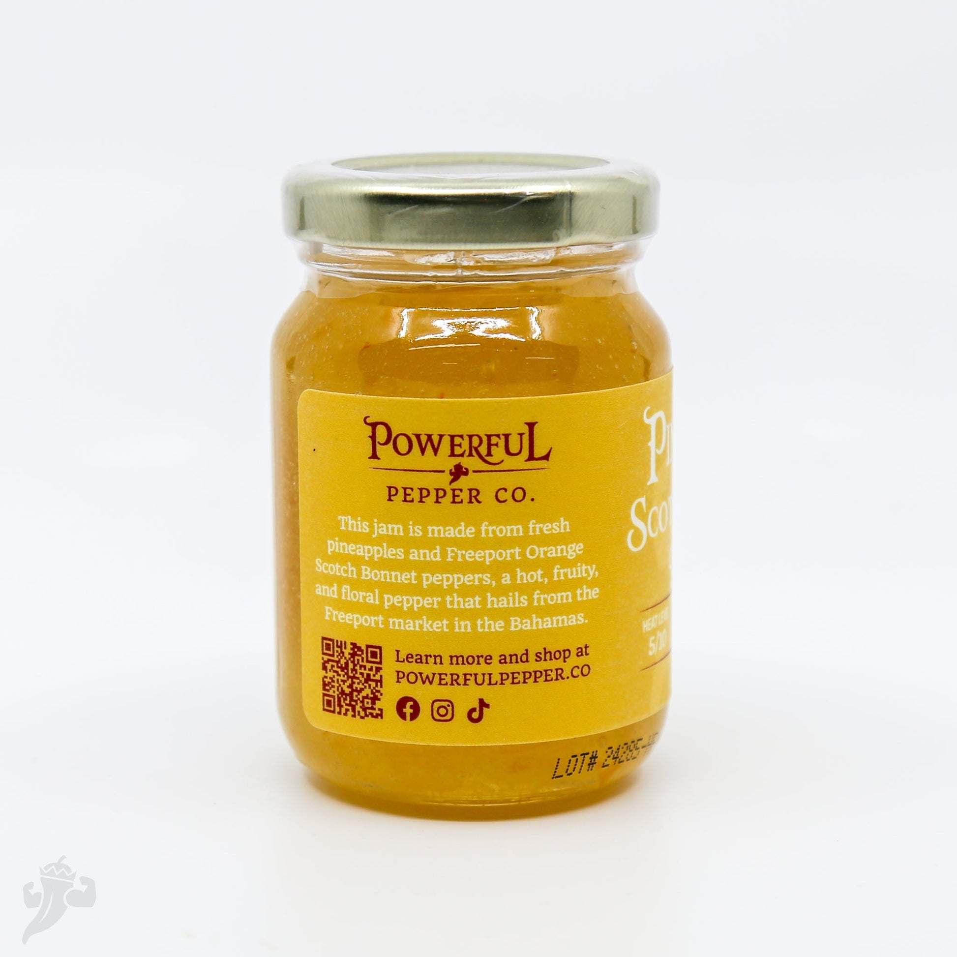 Pineapple Scotch Bonnett Chili Jam from Powerful Pepper Company, a flavorful spread in a glass jar with vibrant chili and pineapple chunks.