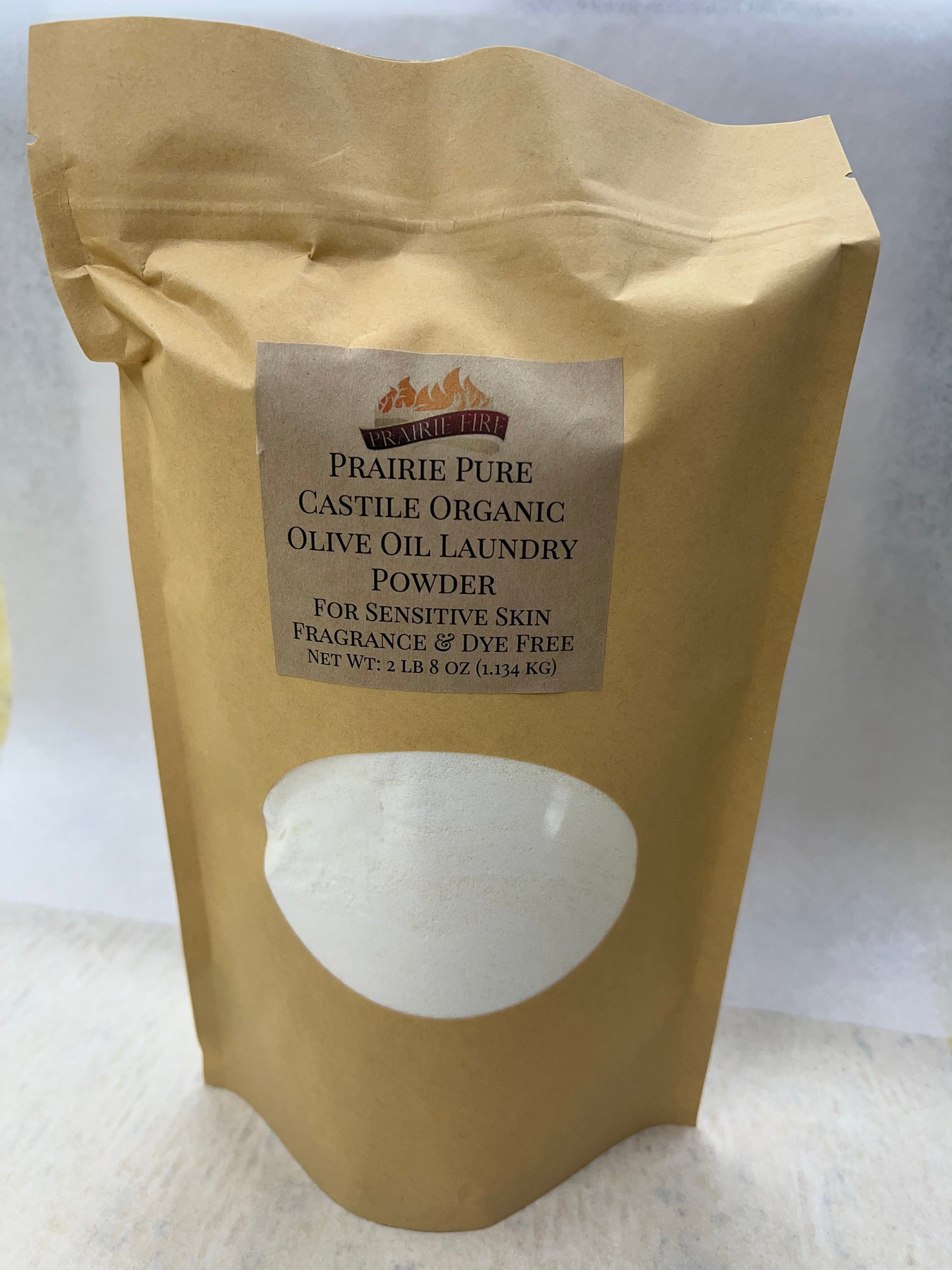 Bar soap from Prairie Fire with organic olive oil, fragrance-free, dye-free, suitable for sensitive skin, part of laundry detergent line.