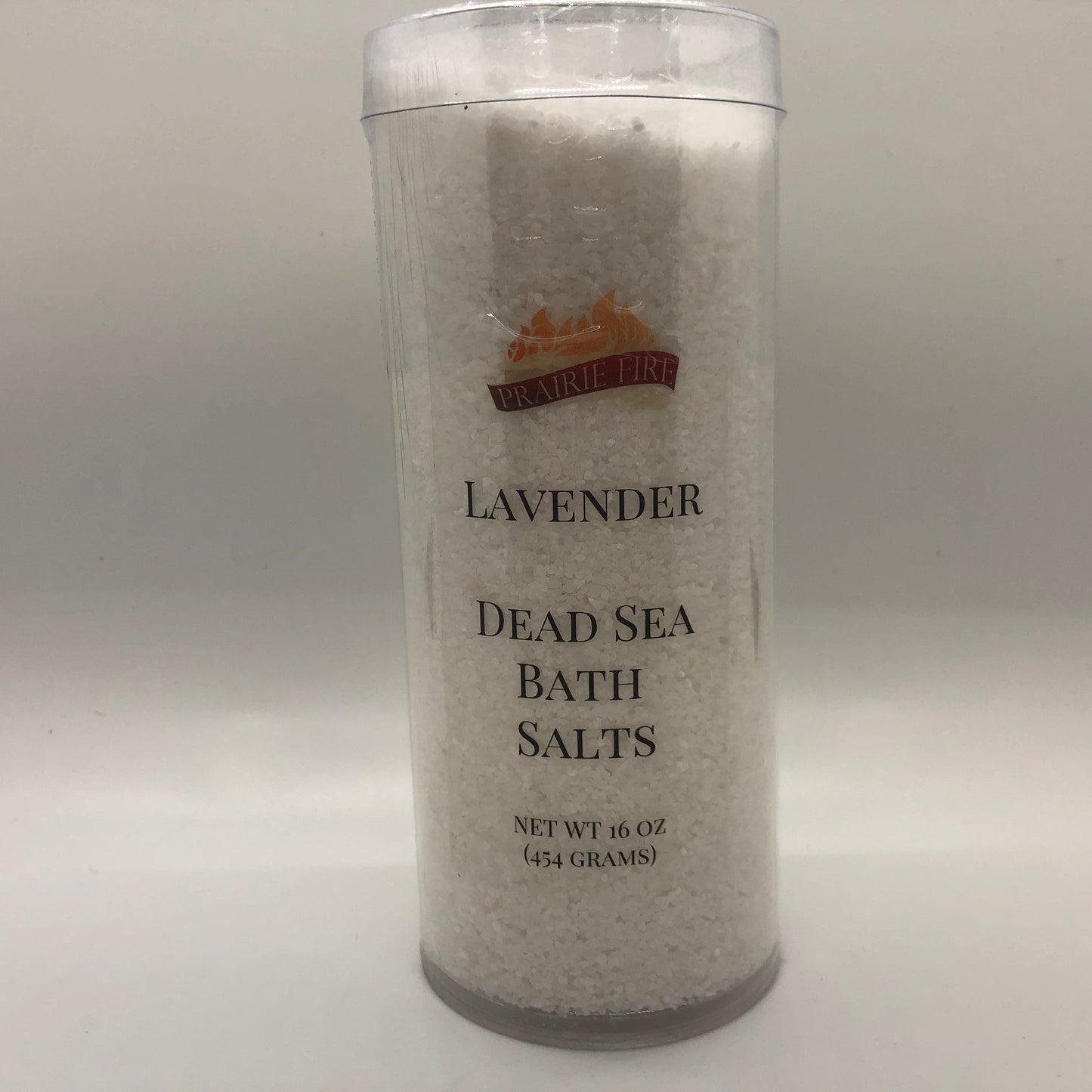 Lavender Dead Sea Bath Salts in a 16oz jar from Prairie Fire, with lavender flowers and salt crystals visible.