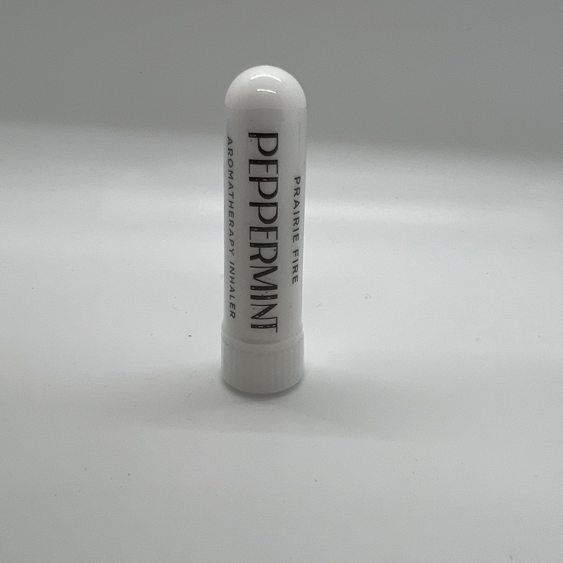 Peppermint aromatherapy inhaler from Prairie Fire Tallow featuring a sleek portable container for refreshing mint scent.
