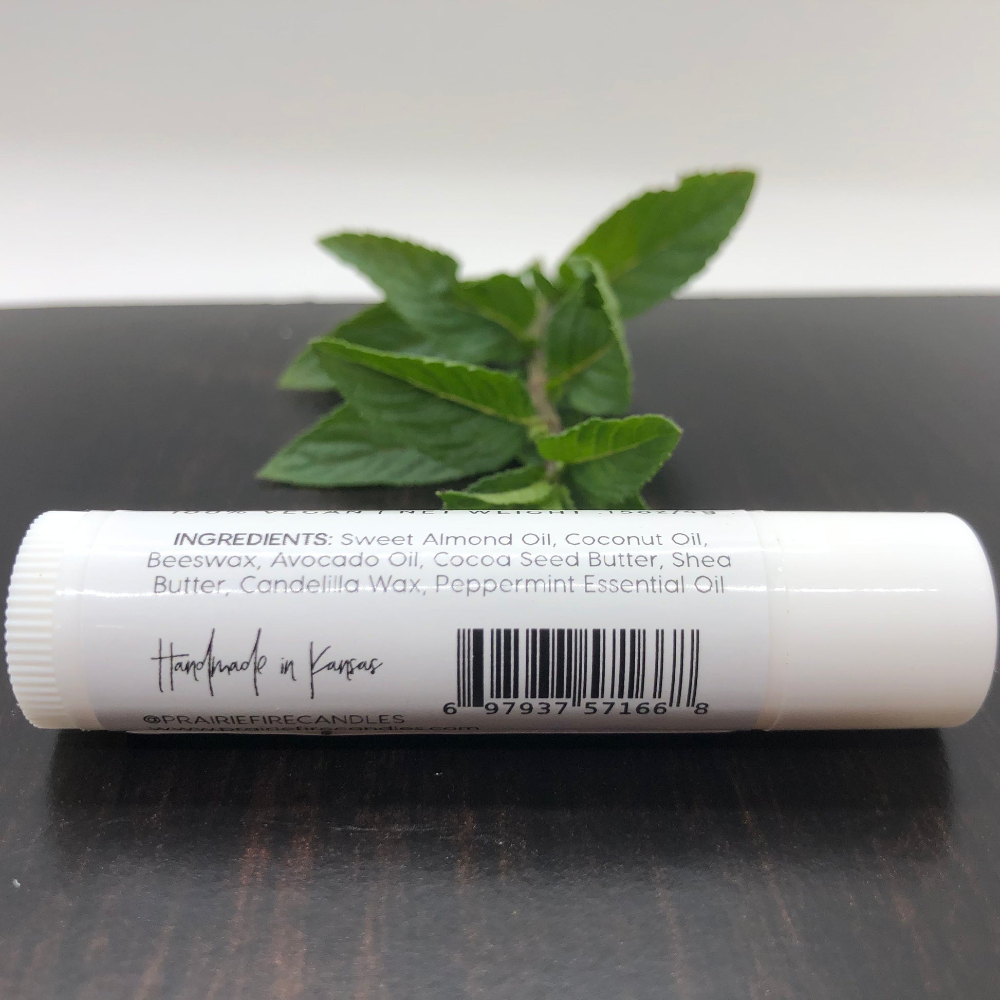 Peppermint Lip Balm by Prairie Fire Tallow in a .15 oz stick, featuring a sleek packaging with peppermint flavor branding.