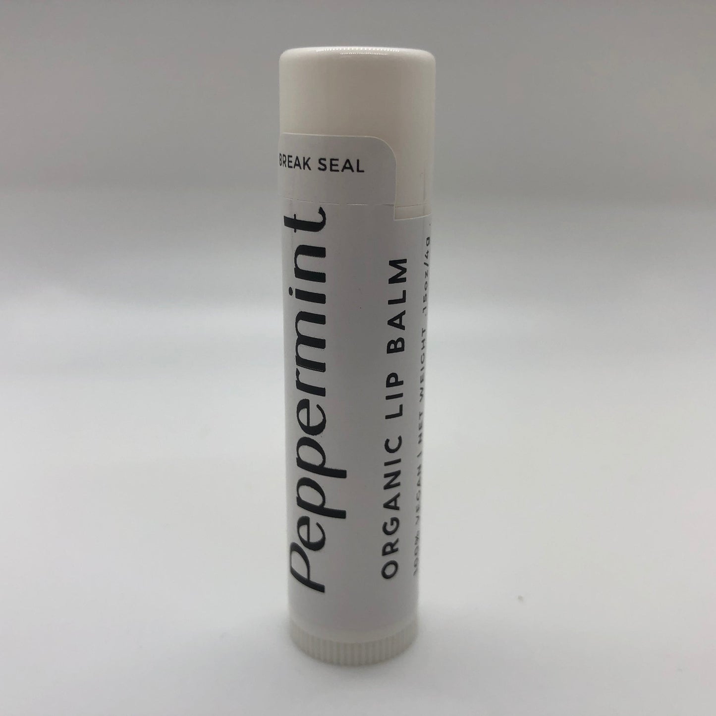 Peppermint lip balm stick from Prairie Fire Tallow with mint-flavored balm in a 0.15 oz tube.