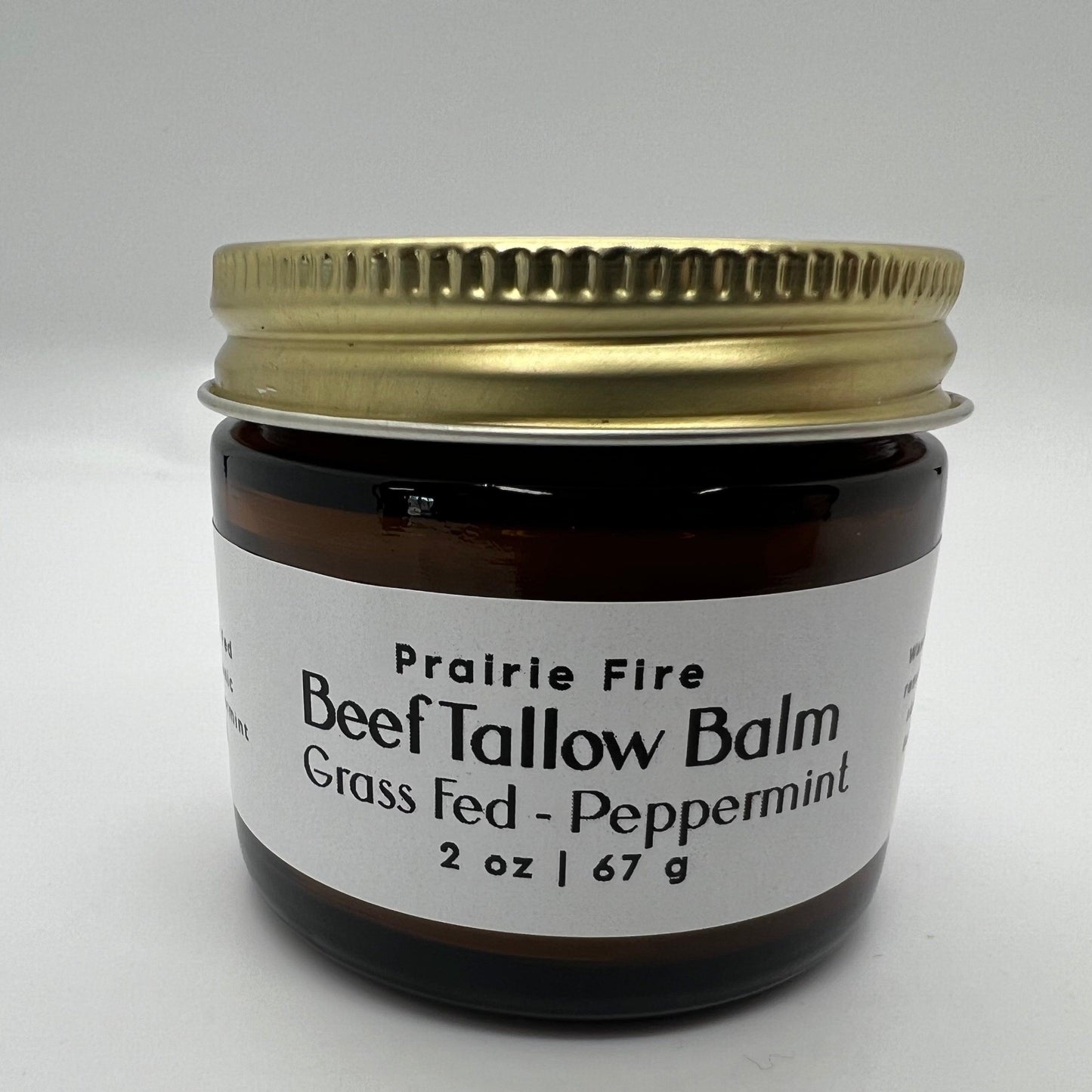 Prairie Fire Tallow organic beef tallow balm in 2 oz jar, moisturizing skin care made from grass-fed, finished tallow, fragrance-free.