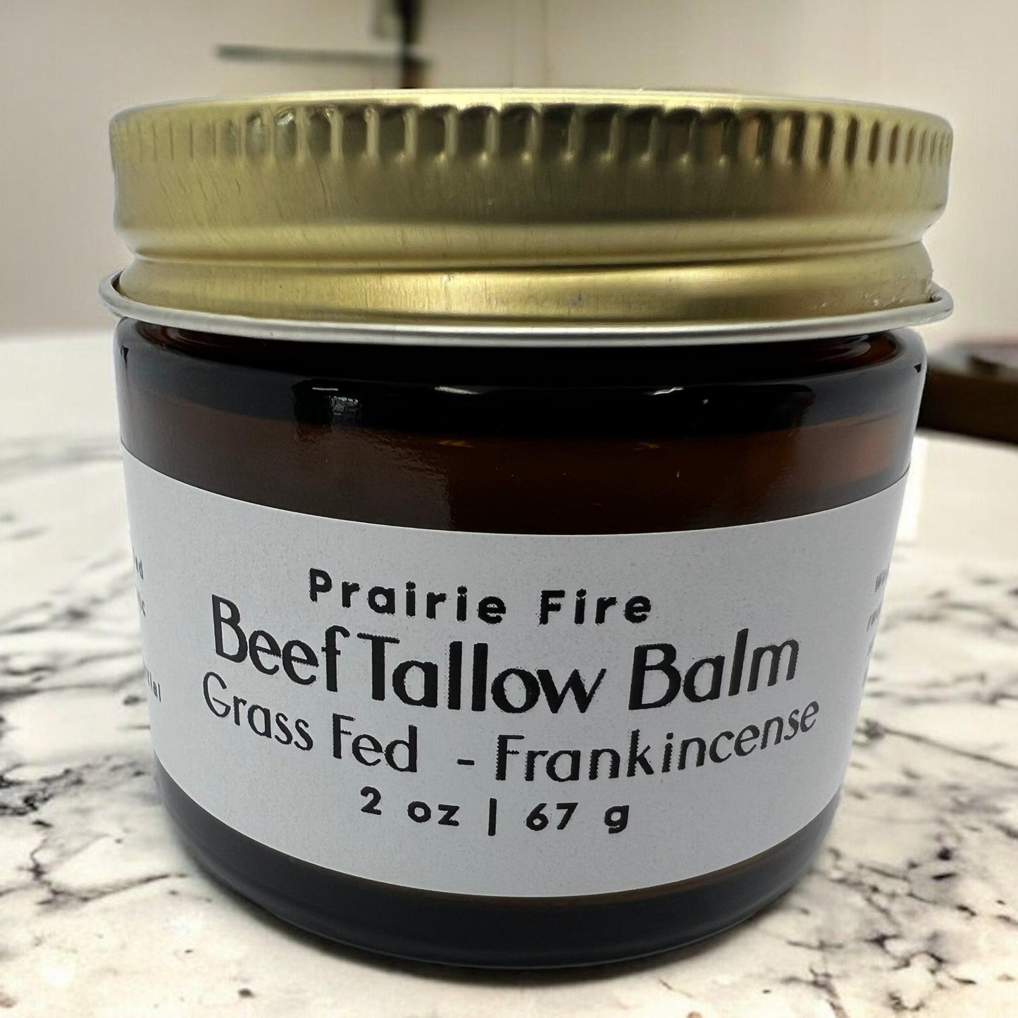 Organic beef tallow balm in a 2 oz jar from Prairie Fire Tallow, made in USA, moisturizing, fragrance-free skin lotion.
